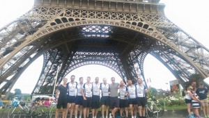 The team in front of the Eiffel Tower