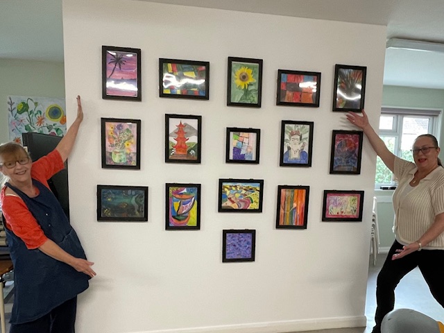Rebecca and Philippa proudly show the finished White Cube Gallery!
