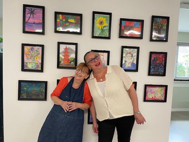 Rebecca and Philippa smile in front of the finished White Cube Gallery